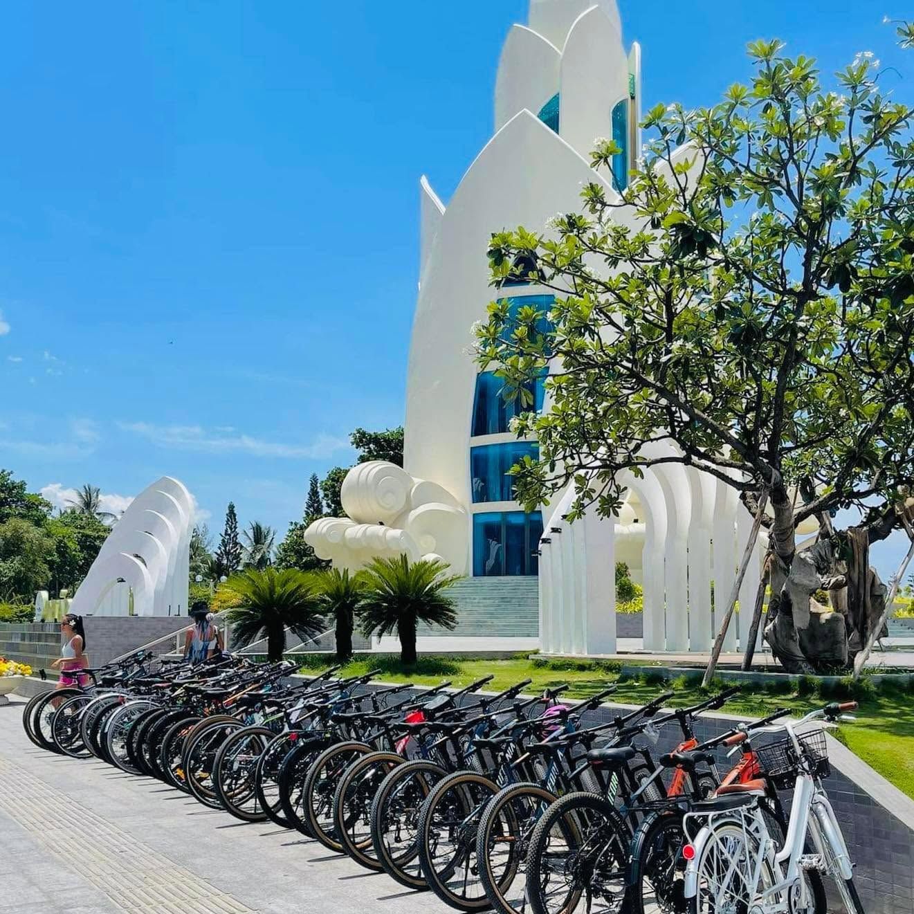 Cycle Station rental bicycles and e-bikes lined up outside the Nha Trang shop