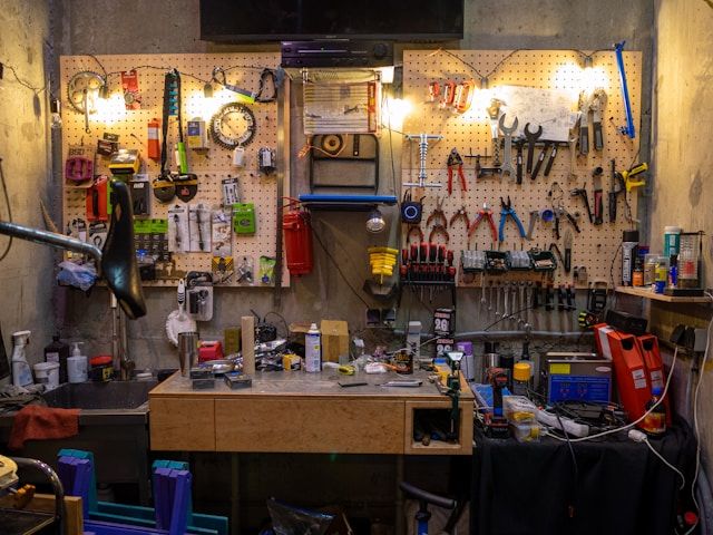 Mechanic tightening a bicycle pedal and crank in the workshop